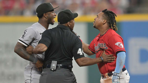 Umpire Malachi Moore tries to separate Guardians third baseman Jose Ramirez (11) and White Sox shortstop Tim Anderson (7) after Ramirez slid into second with an RBI double during the sixth inning at Progressive Field.